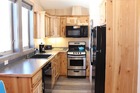 Full kitchen: oven/range, microwave/hood, dishwasher, fridge